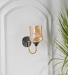 Florian Single Light Wall Fitting In Black And Brass Finish Metal With Amber Glass