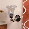 Devansh Metal Electric Wall Light in Antique gold Colour with Transparent Shade Count of 1 Light