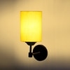 Devansh Metal Electric Wall Light in Black Colour with Yellow Shade Count of 1 Light