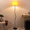 Magnolia Yellow Fabric Floor Lamp with Black Iron Base