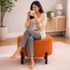 Doe Buck Premium Boucle Round Ottoman in Matte Orange Colour with Polished Black Legs