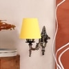 Devansh Metal Electric Wall Light in Antique Gold Colour with Yellow Shade Count of 1 Light