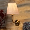 Devansh Metal Electric Wall Light in Gold Colour with White Shade Count of 1 Light