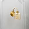 Hendrik Single Light Brass Wall Fitting with Amber Glass