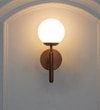 Divina Single Light Wall Fitting In Antique Brass Finish With Opal Frosted White Glass
