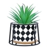 Highly Attractive Faux Plant With A Checkered Patterned Ceramic Pot In A Stand