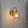 Hendrik Single Light Brass Wall Fitting with Amber Glass