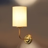 Devansh Metal Electric Wall Light in Gold Colour with off-white Shade Count of 1 Light