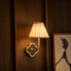 Clover Handicrafted Wall Lamp in Polished gold and K green and off white pleated Colour