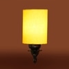 Devansh Metal Electric Wall Light in Antique Gold Colour with Yellow Shade Count of 1 Light