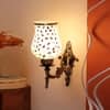 Devansh Metal Electric Wall Light in Antique Gold Colour with Beige Shade Count of 1 Light