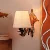 Devansh Metal Electric Wall Light in Antique Gold Colour with White Shade Count of 1 Light