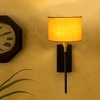 Devansh Metal Electric Wall Light in Black Colour with Yellow Shade Count of 1 Light