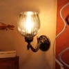 Devansh Metal Electric Wall Light in Antique gold Colour with Lavender Shade Count of 1 Light