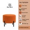 Doe Buck Premium Boucle Round Ottoman in Matte Orange Colour with Polished Black Legs