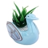 Fern Plant Inside An Artistic Blue Swan Ceramic Pot