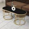 Benton Nesting Black Glass Coffee Table Set With 2 Stools In Gold Finish