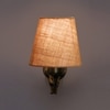 Devansh Metal Electric Wall Light in Antique Gold Colour with Beige Shade Count of 1 Light