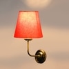 Devansh Metal Electric Wall Light in Gold Colour with Orange Shade Count of 1 Light