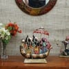 Desert Art Metal Handpainted Dancing Couple Boat Showpiece in Golden Finish