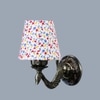 Devansh Metal Electric Wall Light in Antique Gold Colour with Multi Shade Count of 1 Light