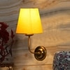 Devansh Metal Electric Wall Light in Gold Colour with Yellow Shade Count of 1 Light