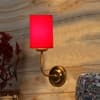 Devansh Metal Electric Wall Light in Gold Colour with Red Shade Count of 1 Light