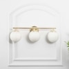 Hollis 3 Light Bathroom Wall Light with Opal Glass In Brass Finish
