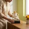 Devotional Lotus Grace Ganesha Statue in White and Gold Colour