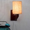Devansh Solid Wood Electric Wall Light in Beige Colour with Beige Shade Count of 1 Light