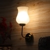 Devansh Metal Electric Wall Light in Gold Colour with White Shade Count of 1 Light