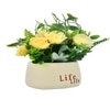 Yellow Artificial Flowers With A Modern Planter