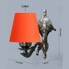 Devansh Metal Electric Wall Light in Antique Gold Colour with Orange Shade Count of 1 Light