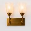 Devansh Metal Electric Wall Light in Antique Gold Colour with Beige Shade Count of 1 Light