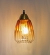 Kichler Single Light Wall Fitting In Brass And Wood Finish Metal With Amber Glass