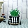 Highly Attractive Faux Plant With A Checkered Patterned Ceramic Pot In A Stand