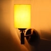 Devansh Metal Electric Wall Light in Gold Colour with Yellow Shade Count of 1 Light