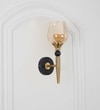 Mantis Single Light Wall Fitting In Black And Brass Finish Metal With Amber Glass