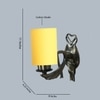 Devansh Metal Electric Wall Light in Antique Gold Colour with Yellow Shade Count of 1 Light
