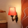 Devansh Metal Electric Wall Light in Antique Gold Colour with Orange Shade Count of 1 Light