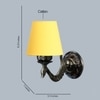 Devansh Metal Electric Wall Light in Antique Gold Colour with Yellow Shade Count of 1 Light