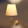 Devansh Metal Electric Wall Light in Gold Colour with off-white Shade Count of 1 Light