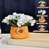 White Artificial Flowers Bunch With Orange Pot