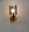 Isabella Single Light Wall Fitting In Black And Brass Finish Metal With Smoke Glass
