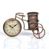 Desert Art Metal Handpainted Cycle Pen Stand with Clock in Golden Finish