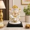Devotional Regal Vinayaka Ganesha Statue in White Colour