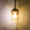 Hendrik Single Light Brass Wall Fitting with Amber Glass