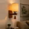 Devansh Metal Electric Wall Light in Black Colour with off-white Shade Count of 1 Light