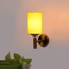 Devansh Metal Electric Wall Light in Gold Colour with Yellow Shade Count of 1 Light