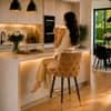 Doe Buck Upholstered Counter Height Bar Stool in Brown Colour with Gold Accents